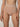A close-up of a model wearing high-waisted, seamless underwear in a light nude beige color, shown from the waist to the upper thighs against a neutral studio background.