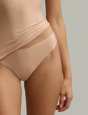 Beige Butter Thong in ultra-soft Austrian modal fabric with raw-cut edges for a smooth, line-free look.