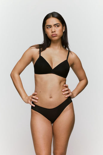 model wearing the Andres Sarda Chalmers bralette in black with padded wireless cups and semi-sheer details