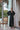 Black long silk satin dressing gown with lace-trimmed sleeves, guipure back, and waist tie for an elegant and sensual silhouette.