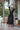 Black long silk satin dressing gown with lace-trimmed sleeves, guipure back, and waist tie for an elegant and sensual silhouette.