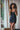 Black short silk dress with lace trim and adjustable straps, offering an elegant silhouette with sensual, fluid comfort and refined detail.
