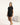 Black bamboo T-shirt with side seams and cuts, thermoregulating and eco-friendly for breathable, stylish loungewear or layering.
