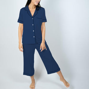 Model wearing Aspen Dream's Jolene Cropped Pajama Set in Navy with short sleeve top and cropped pants
