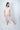 Model wearing Aspen Dream Jolene Cropped Pajama Set in Powder Rose.