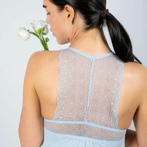 Baby Blue bamboo chemise with lace racerback and sheer lace underbust, offering breathable comfort and chic, body-hugging elegance.