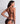 Back view of black lace triangle bra showing crossed adjustable straps