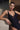 Model wearing the Branda one-piece swimsuit in black with floral embroidery and plunging neckline