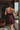 model wearing the Calista nightdress by Marjolaine with a V-neck and adjustable spaghetti straps in brun(brown)