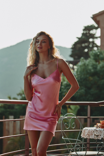 model wearing the Calista nightdress by Marjolaine with a V-neck and adjustable spaghetti straps in blush(pink)