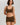 Classic seamless brown sports bra in soft ribbed fabric with light support and smooth fit, perfect for everyday comfort.