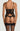 Back view of black embroidered basque with hook and eye closure, adjustable straps, and suspender straps, with matching thong