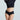 Model wearing a black crop top and high-waisted black Butter Hipster by Commando