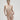 Essentiel nude seamless strapless bra with underwire and molded cups, microfiber comfort, and multi-way straps for versatile styling.