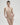 Essentiel nude seamless strapless bra with underwire and molded cups, microfiber comfort, and multi-way straps for versatile styling.