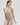 Essentiel nude seamless strapless bra with underwire and molded cups, microfiber comfort, and multi-way straps for versatile styling.