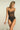 Black lace underwire bodysuit with scalloped eyelash lace neckline, corset style seams, and smooth opaque brief
