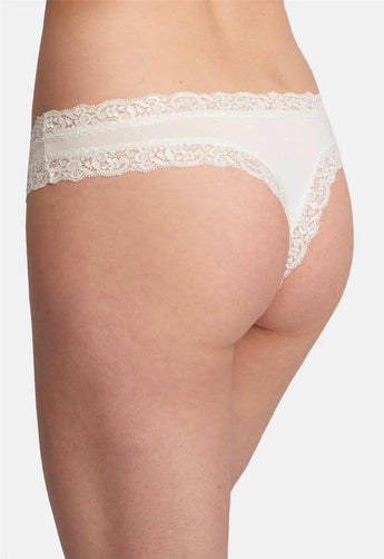 Chatilly Fleur’t mid-rise thong in soft TENCEL™ Modal with flat lace trim, seamless fit, and cotton gusset for breathable comfort.