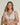 Forte white wireless bralette with French floral lace, plunge neckline, scalloped edges, and soft triangle cups for a bold, feminine look.