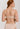 HANRO Satin Deluxe beige soft cup T-shirt bra in silky viscose with plunge neckline, padding, and matte gold hardware.