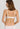 HANRO Satin Deluxe white soft cup T-shirt bra in silky viscose with plunge neckline, padding, and matte gold hardware.