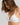 HANRO Satin Deluxe white soft cup T-shirt bra in silky viscose with plunge neckline, padding, and matte gold hardware.