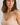 HANRO beige seamless V-neck camisole in mercerized cotton with satin trim and adjustable straps, perfect for layering or wearing alone.
