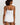 HANRO white seamless V-neck camisole in mercerized cotton with satin trim and adjustable straps, perfect for layering or wearing alone.