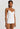 HANRO white seamless V-neck camisole in mercerized cotton with satin trim and adjustable straps, perfect for layering or wearing alone.