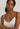 HANRO white seamless V-neck camisole in mercerized cotton with satin trim and adjustable straps, perfect for layering or wearing alone.