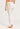 Back view of model wearing Hanro Woolen Silk Long Leg in white showing smooth seams and slim fit