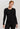 Model wearing a long-sleeve wool-silk thermal top in black by Hanro.