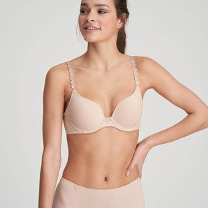 Caffee Heart-shaped padded foam bra in soft white with seamless finish, underwire support, and multi-way straps.
