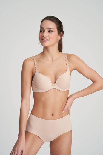 Caffee Heart-shaped padded foam bra in soft white with seamless finish, underwire support, and multi-way straps.