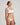White Heart-shaped foam cup bra with daisy straps and silicone-backed support, convertible to halter or shoulder style.