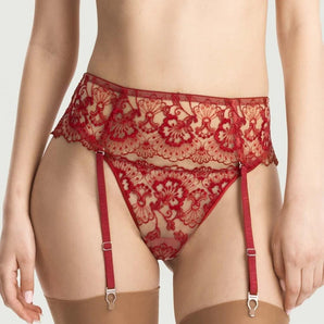 Close-up of red floral lace suspender belt with adjustable garter straps and metal clips