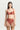 Red floral lace suspender belt, front view with garter straps attached to stockings