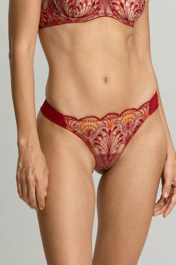 Model wearing the Memories of Love thong by I.D. Sarrieri in dark red showing embroidered lace design