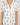 Jolene Hummingbirds print short pajama set with orange piping, short-sleeve top, and longer shorts in soft bamboo fabric.
