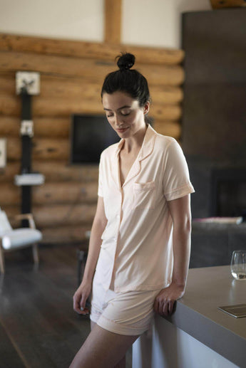Jolene Rosewater pajama set with ruffled piping, short-sleeve top, and mid-rise shorts in soft, breathable bamboo.