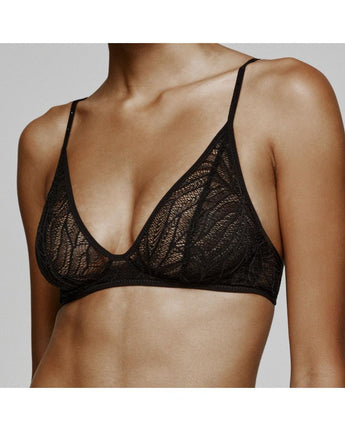 model wearing the Mae bralette by Andres Sarda in black lace with thin straps