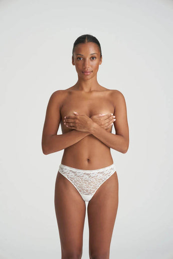 Marie Jo Color Studio lace thong in white with seamless finish for a sleek, invisible fit and flattering everyday comfort.