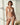 Marie Jo Rio briefs in beige with feather-light fabric, seamless back, Brazilian cut, and elegant pearl strap detail.