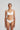 Marie Jo Rio briefs in white with feather-light fabric, seamless back, Brazilian cut, and elegant pearl strap detail.