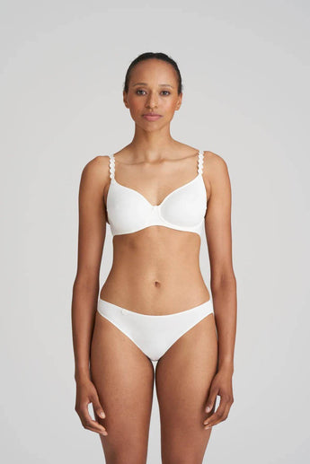 Marie Jo Rio briefs in white with feather-light fabric, seamless back, Brazilian cut, and elegant pearl strap detail.
