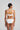 Marie Jo Rio briefs in white with feather-light fabric, seamless back, Brazilian cut, and elegant pearl strap detail.