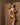 Back view of Marjolaine Benedicte Nightdress showing fluid silk drape and elegant cut in hazelnut