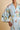 Close-up of the Olivia von Halle Queenie Cadiz Blue Seafood silk robe highlighting the exclusive Seafood print, shawl collar, self-tie belt, and luxurious 19 momme silk satin.
