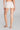 Model wearing Oscalito Silk Middle Rise Panties with Leavers Lace in white showing seamless fit and soft rib texture