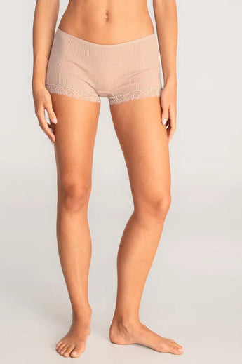 Model wearing Oscalito Silk Middle Rise Panties with Leavers Lace in beige showing lace trim and rib-knit fabric